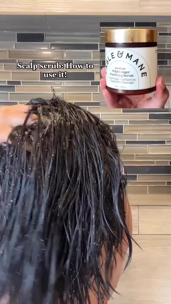 This contains: Professional hairstylist showing a tutorial of how to use scalp scrub to achieve optimal scalp health