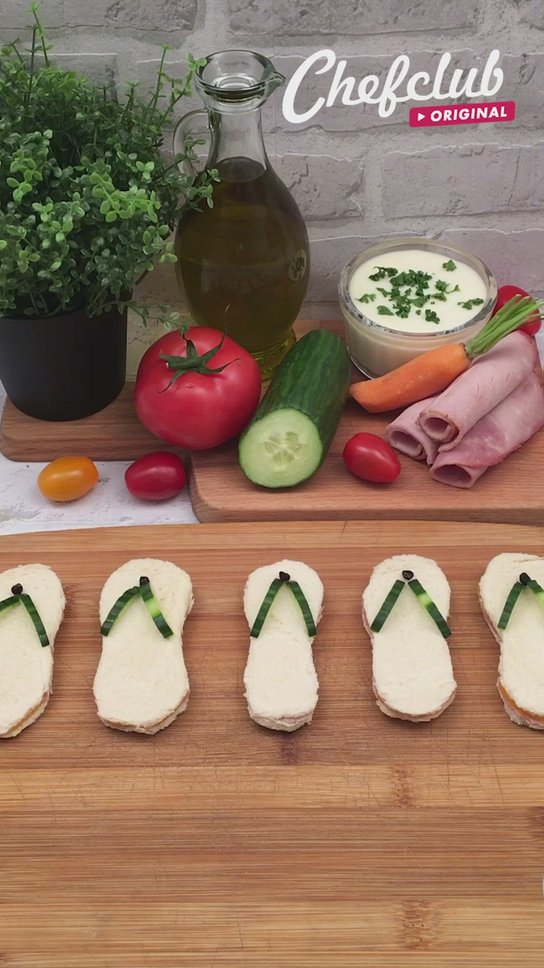 This may contain: several sandwiches are arranged on a cutting board with vegetables and dip in the middle, along with other food items