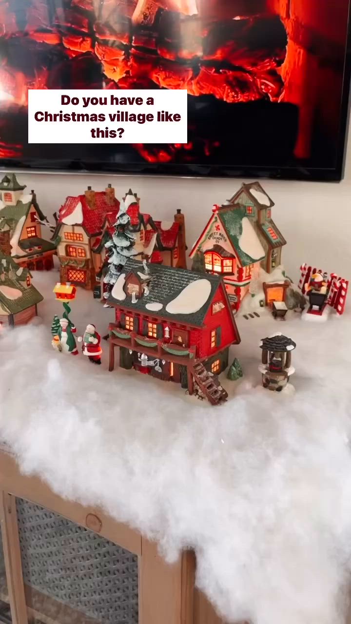 This may contain: christmas village tips and tricks displayed in front of fireplace with holiday decorations on mantles