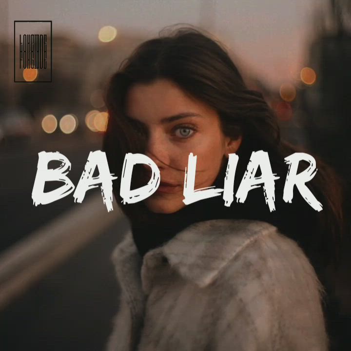 This may contain: a woman standing in front of a street with the words bad lar on it