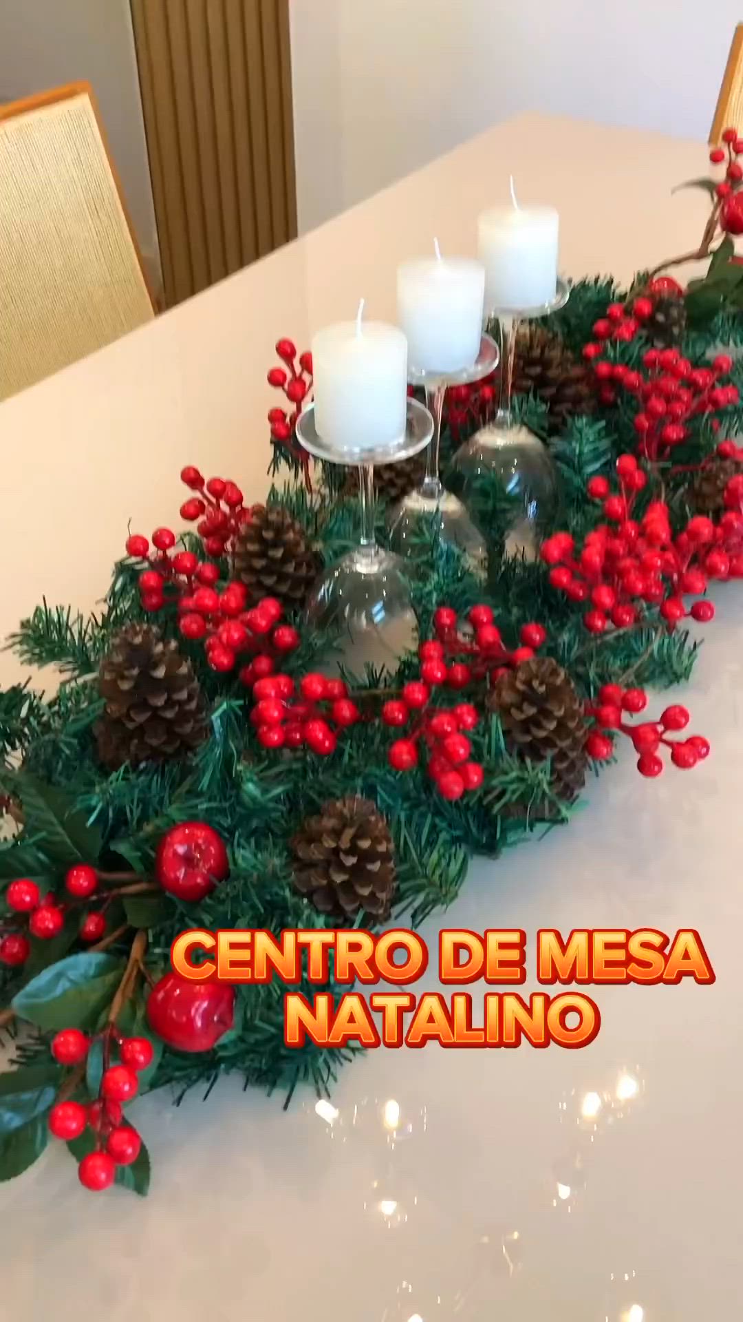 This may contain: the centerpiece is decorated with pine cones and red berries