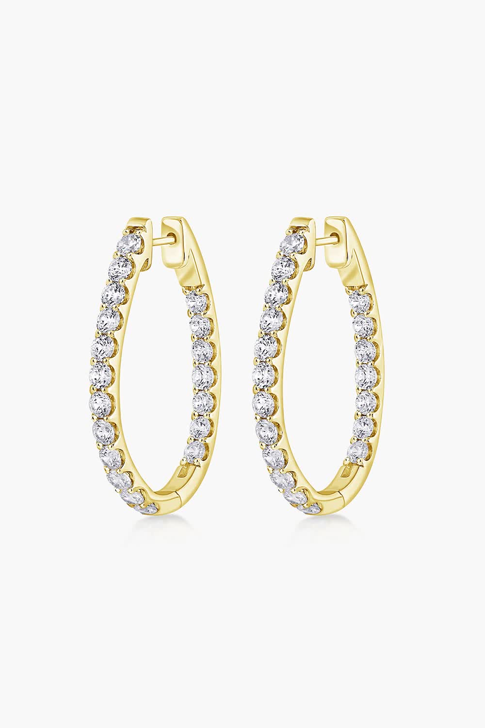 MiaDonna's exquisite 14K Diamond Inside-Out Pavé-Set Oval Hoop Earrings feature a total carat weight ranging from 2.0ctw to 5.0ctw, designed with sparkling lab-grown round diamonds pavé-set on both the inside and outside of the oval-shaped hoops, offering a captivating brilliance from every angle. 

Crafted in 14K White, Yellow, or Rose Gold, these oval hoops combine classic sophistication with modern glamour, making them a perfect choice for both everyday luxury and special occasions. 