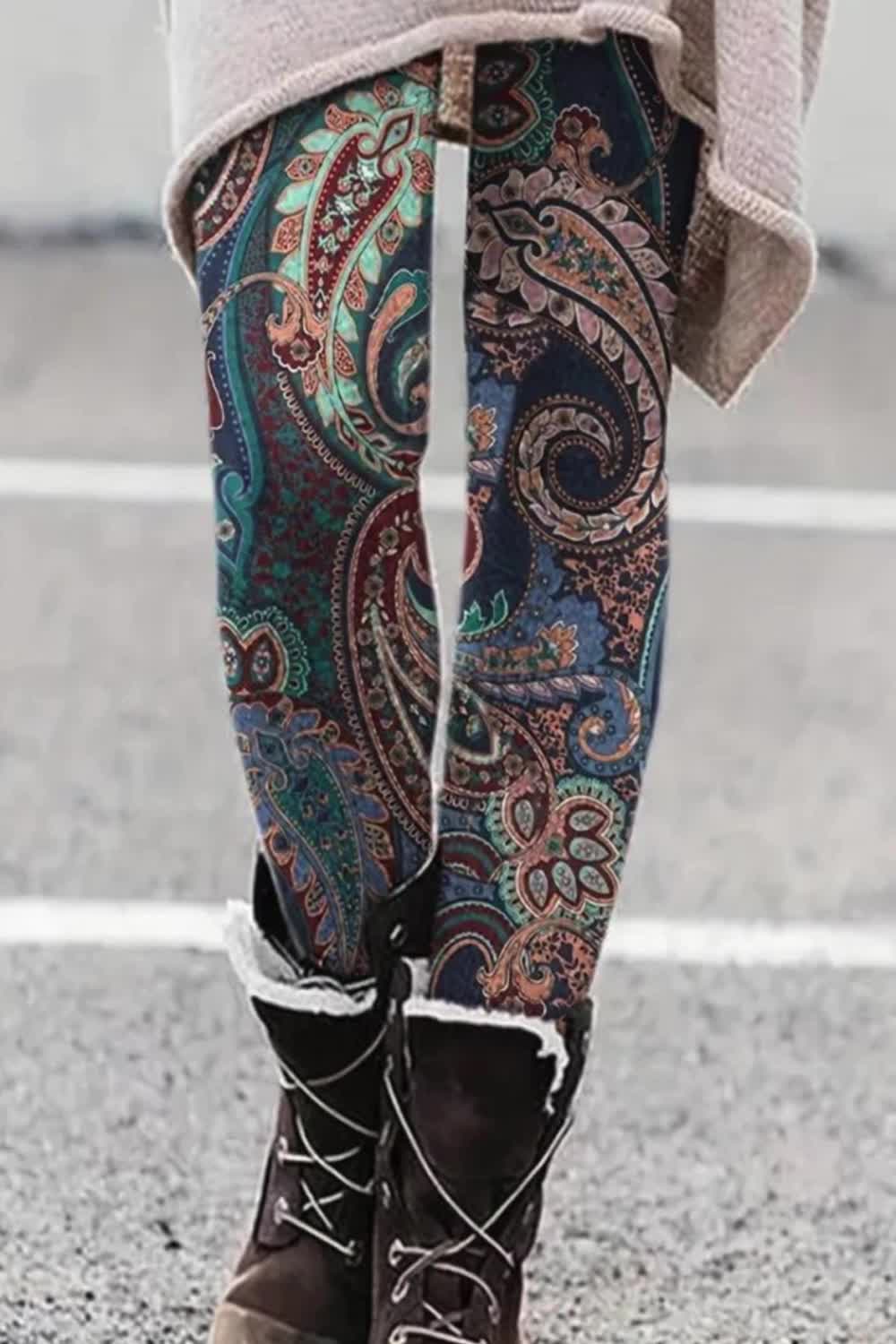 These plus size boho leggings feature a vibrant paisley floral print and a high-rise elastic waistband for maximum comfort. Made with high-stretch fabric, they provide a flattering fit that moves with you. Perfect for casual outings or lounging, they add a stylish touch to any wardrobe.