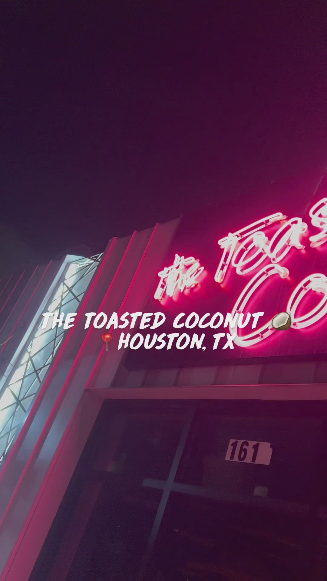 This may contain: the toasted coconut houston tx restaurant is lit up at night