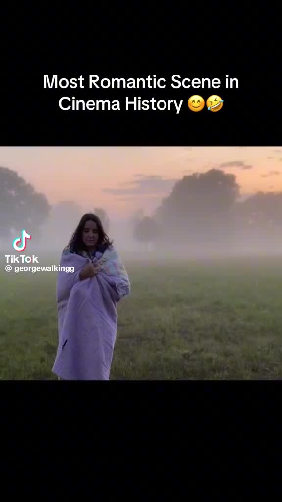 This may contain: a woman standing in the middle of a foggy field