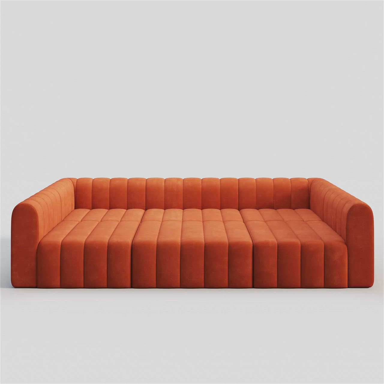 This may contain: an orange couch sitting on top of a white floor