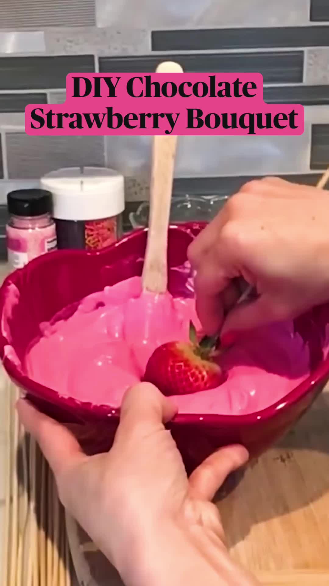 This may contain: a bouquet of pink and white heart shaped chocolates with the words diy chocolate strawberry bouquet