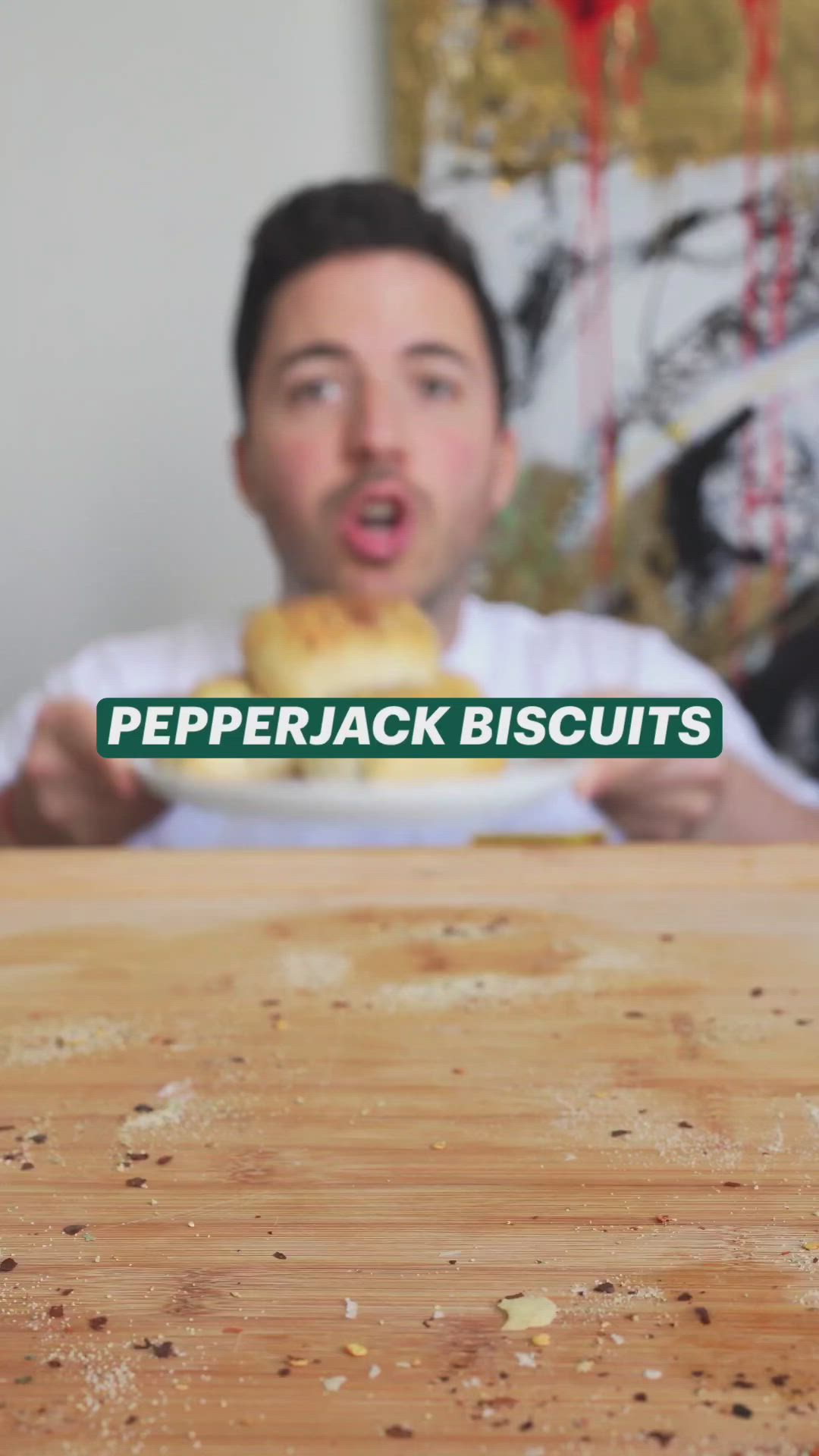 This may contain: a man is eating some bread on a plate