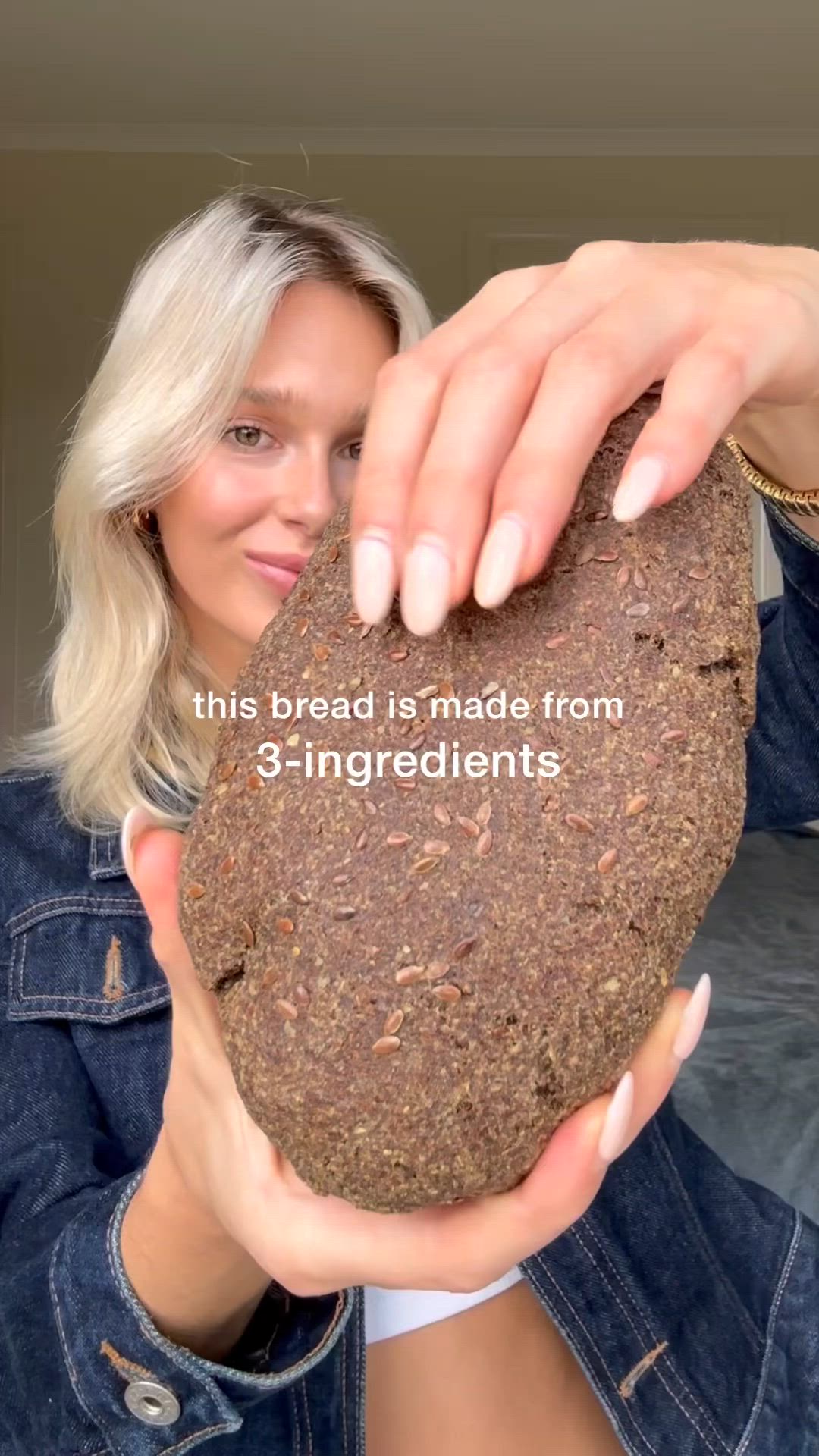 This may contain: a woman holding up a cookie with the words, this bread is made from 3 ingredients