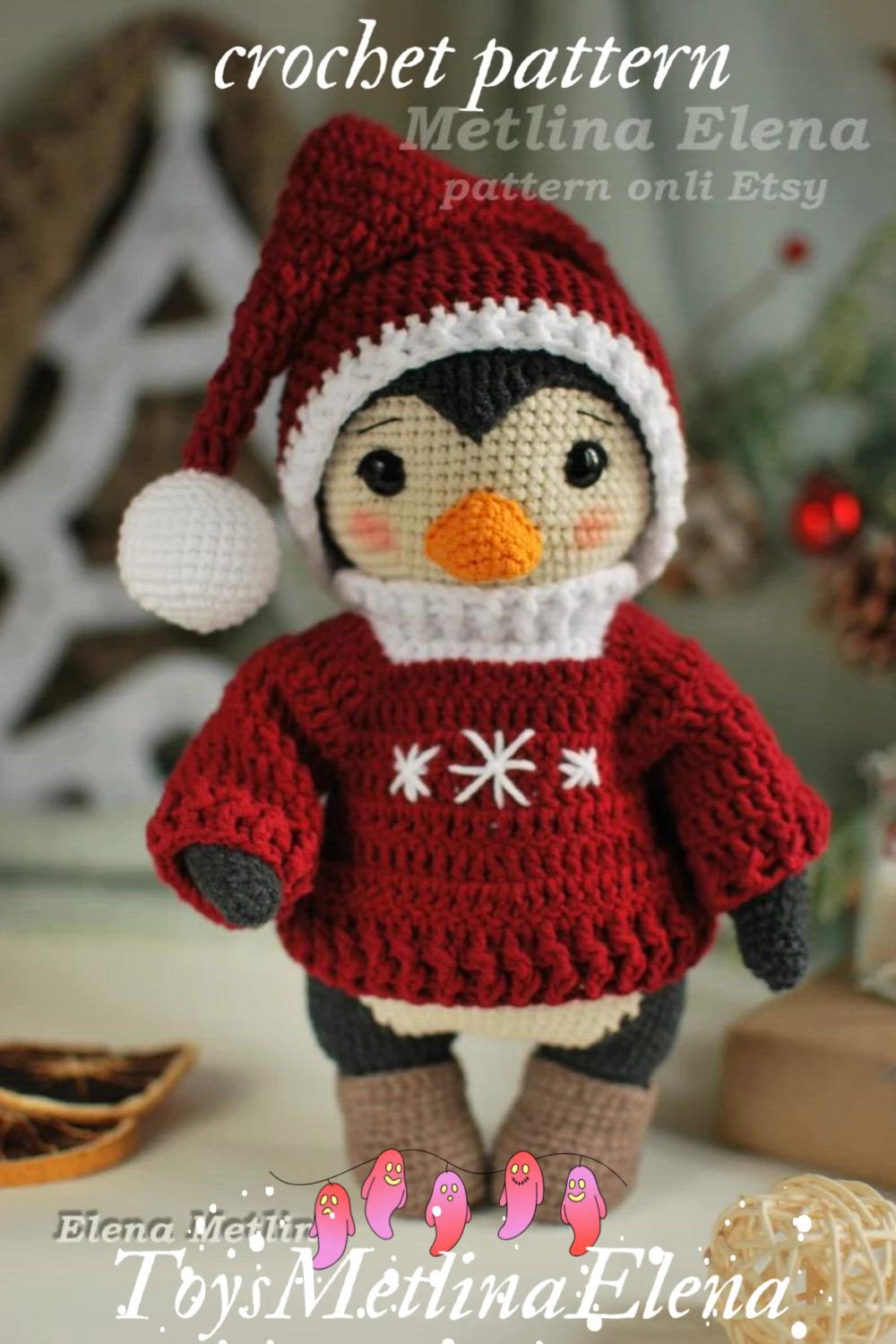 This may contain: a crochet penguin doll wearing a red sweater and hat with snowflakes