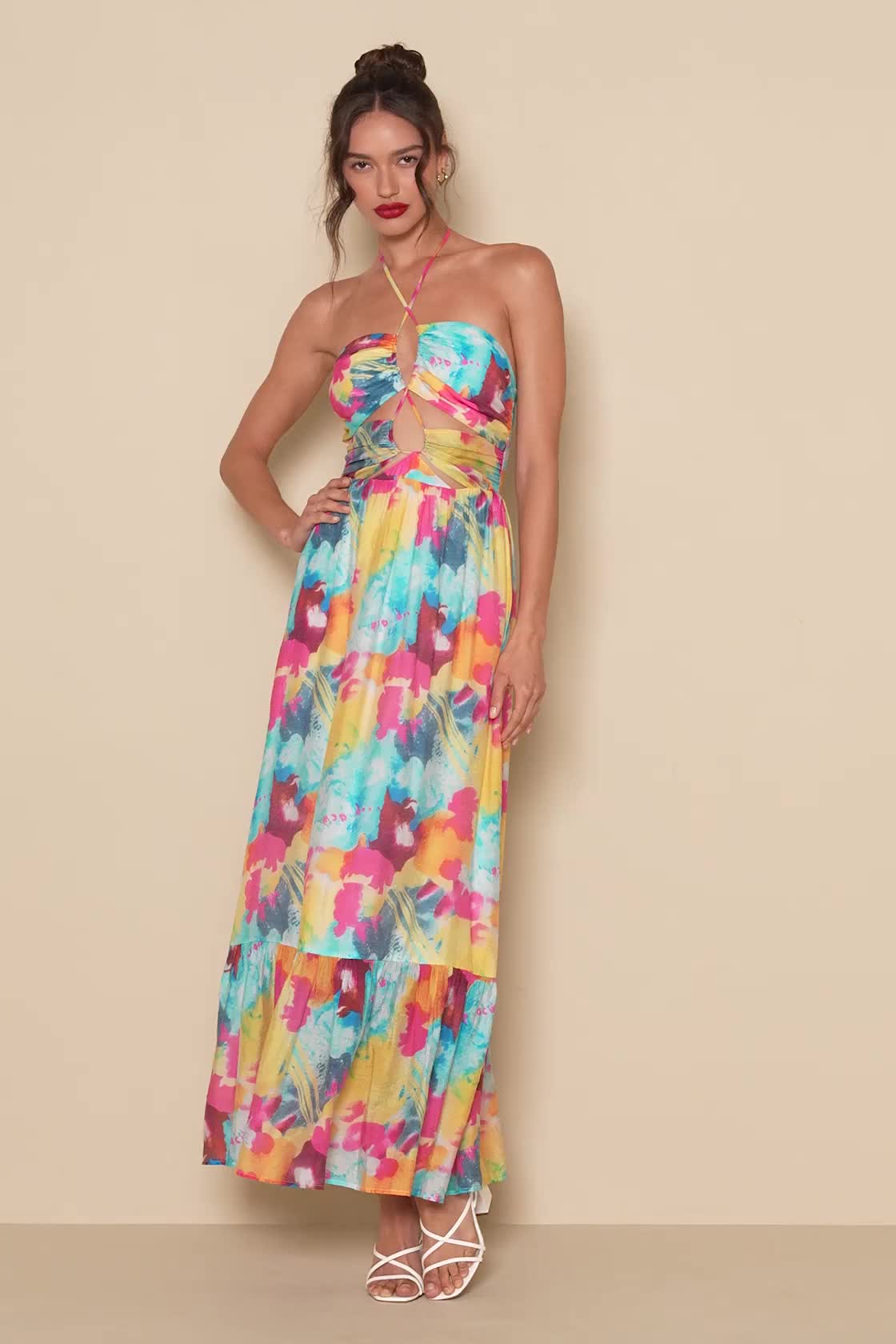 You'll take every summer soiree by storm when you've got the Lulus Stunning One Multi Abstract Print Drawstring Halter Maxi Dress! Lightweight woven chiffon, with a vibrant abstract print and subtle texture throughout, shapes this flirty dress. Slender drawstring ties form a halter neckline and continue down the overlapping bodice panels to create plunging cutout details. The flowy skirt ends at a tiered hem. Hidden back zipper/clasp. Fit: This garment runs small - please size up. Length: Ankle 