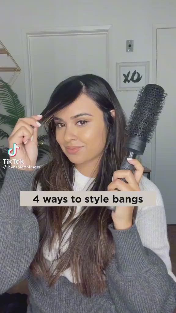 This contains an image of: How to style bangs?