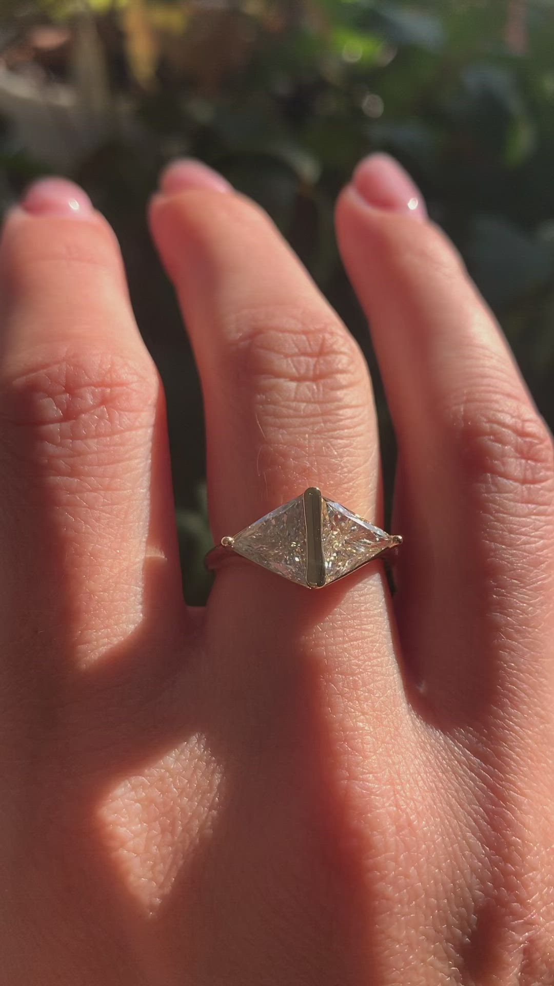 This contains an image of: East-west setting with two mesmerizing triangle diamonds💫