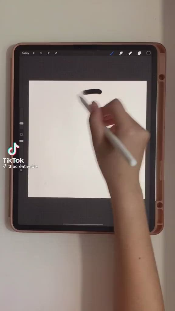 This may contain: a person is using a tablet to draw the word may on it with a marker