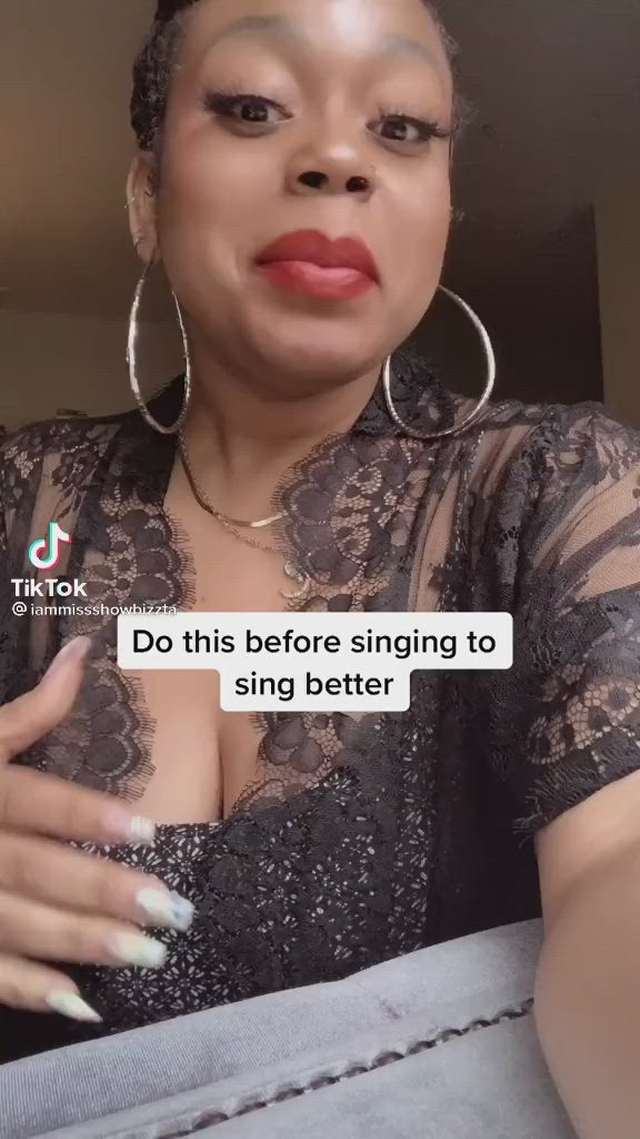 This may contain: a woman with her hand on her chest and the text do this before singing to sing better