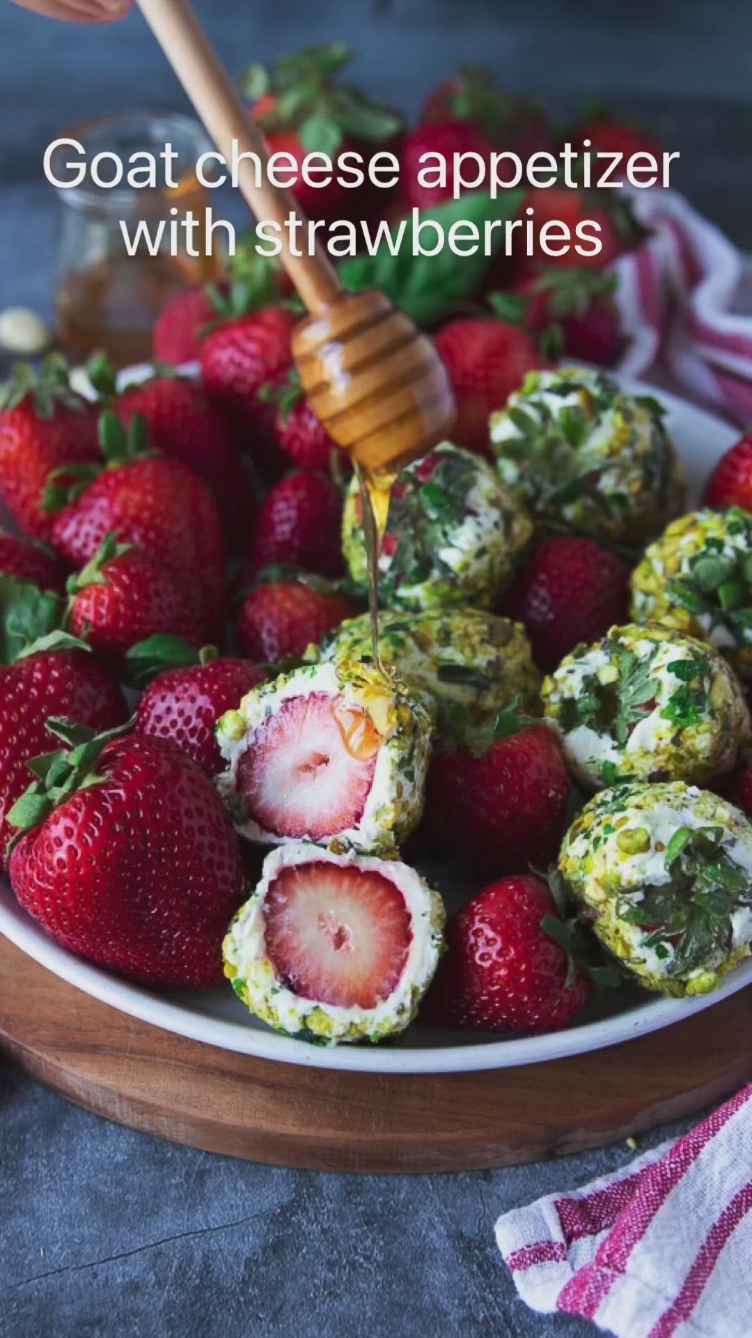 This may contain: strawberries and cheese appetizer with strawberries in a bowl on a table