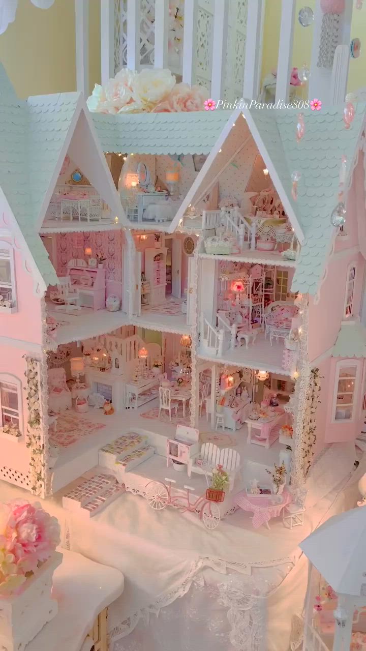 This may contain: a doll house with furniture and accessories inside