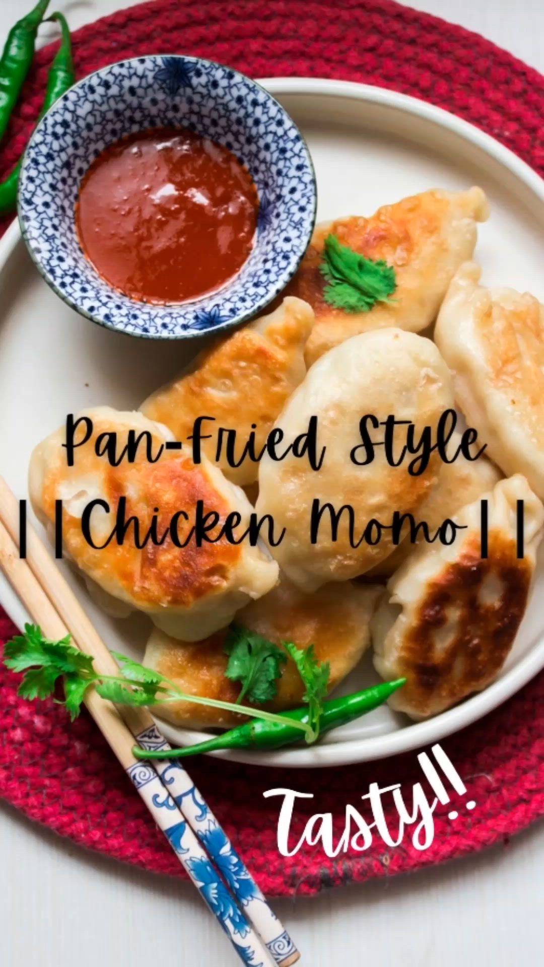 This may contain: a plate with dumplings and dipping sauce on it that says, i tried style chicken momo