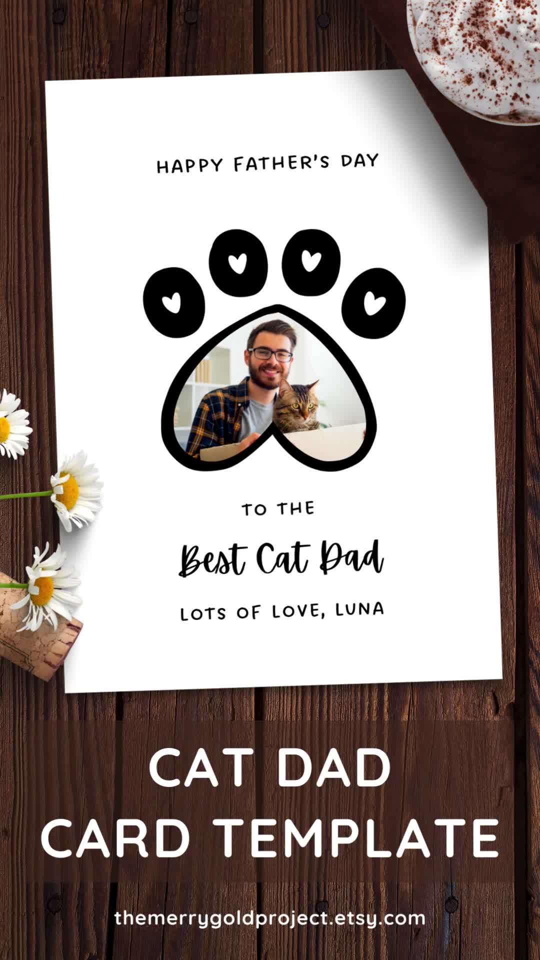 This may contain: the cat dad card is displayed next to some daisies