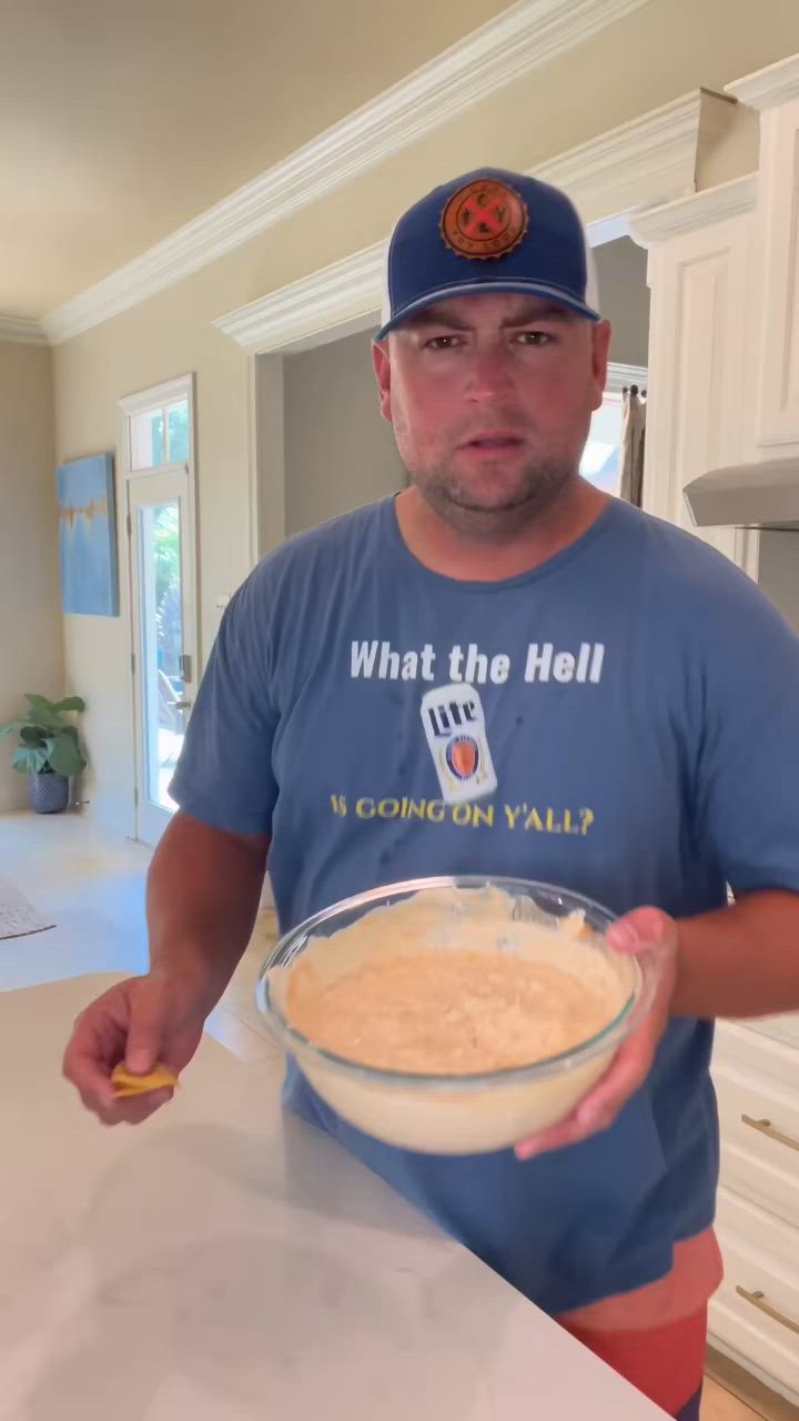 This may contain: a man in a baseball cap is mixing food into a bowl with the words boat dp on it