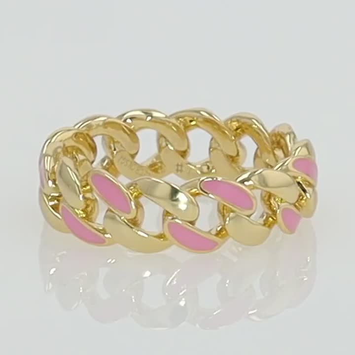 Accessorize in style with this gold tone pink enamel band ring. Click on this JEWELRY & WATCHES GUIDE to learn about fit, styles, materials and more! Accessorize in style with this gold tone pink enamel band ring. Click on this JEWELRY & WATCHES GUIDE to learn about fit, styles, materials and more! FEATURES Width: 5.5 mm Shank style: scalloped Band fit: comfort fit Metal: brass Plating: 14k gold Finish: polished Packaging: velvety pouch Size: 7. Gender: female. Age Group: adult.