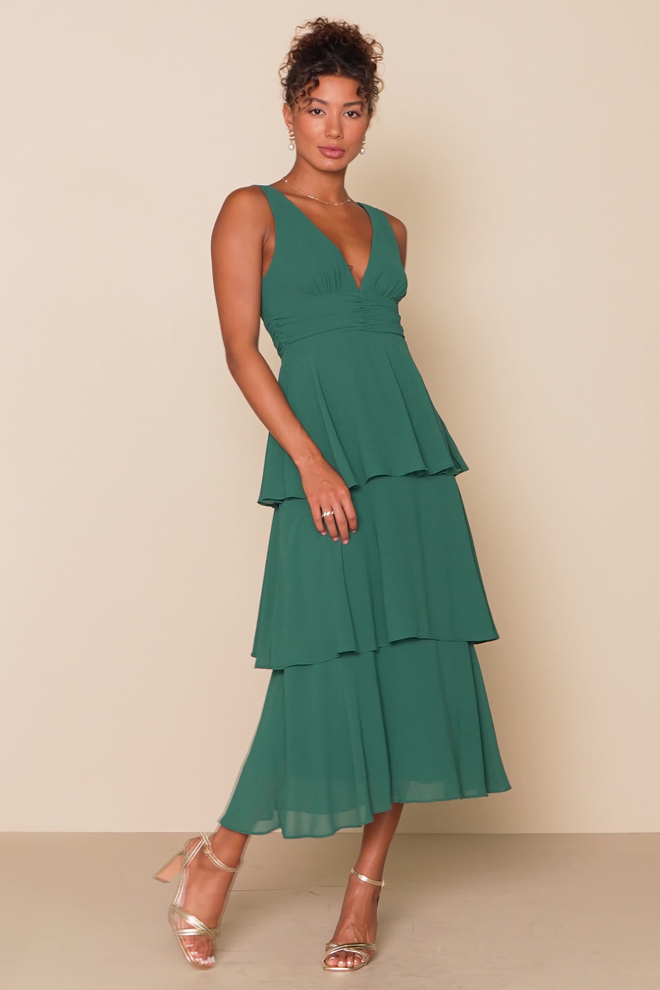 Any event will feel like a celebration when you're in the Lulus Celebration Time Emerald Green Sleeveless Tiered Midi Dress! Woven chiffon shapes this chic dress that has wide straps, a V-neckline (and back), and a fitted bodice. A gathered waist tops an A-line midi skirt that's accented with flouncy tiers. Hidden side zipper/clasp. Fit: This garment fits true to size. Length: Mid-calf length. Size medium measures 50.5" from shoulder to hem. Bust: Great for any cup size. Waist: Fitted - very fit