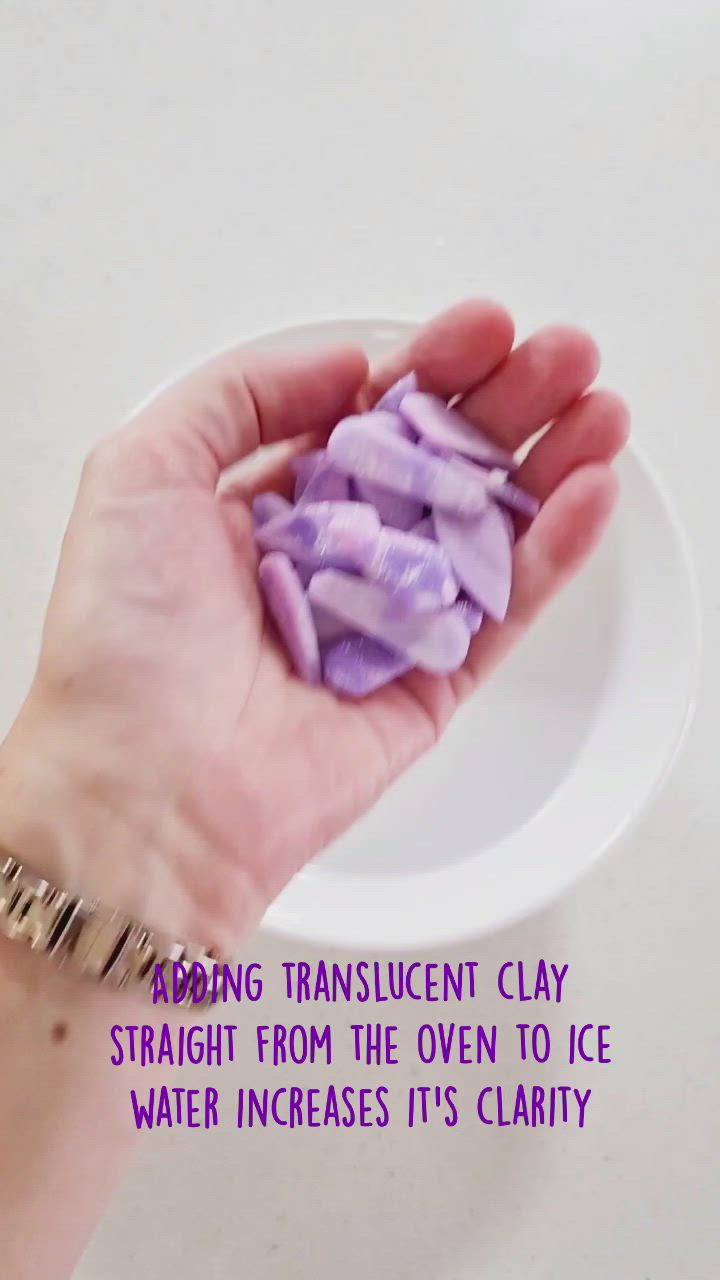 This may contain: a hand holding a small purple object in it's palm with the caption saying, strong translucent clay straight from the oven to ice water increase its clarity