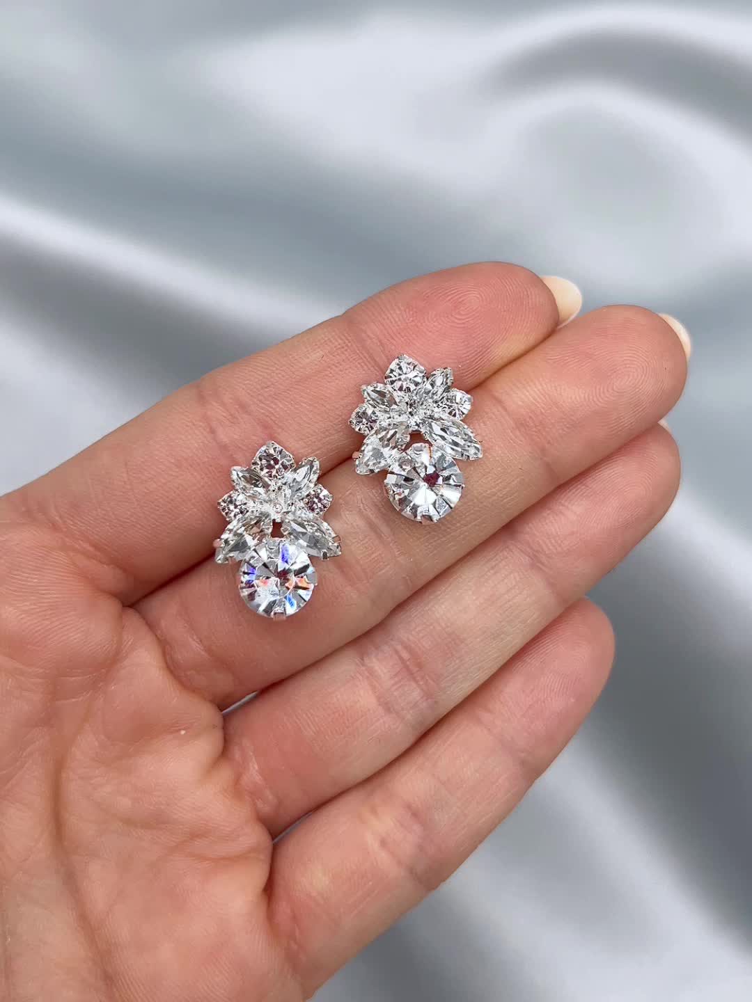 Add a pop of sparkle with our Crissy Stud Earrings. Beautifully crafted with marquise & round shaped crystals, you'll want to wear these studs again & again. Crystal gemstones Measures 0.75" length x 0.5" wide Hypoallergenic, lead-free & nickel-free Crissy Earrings shown with Monica Comb Style #4439