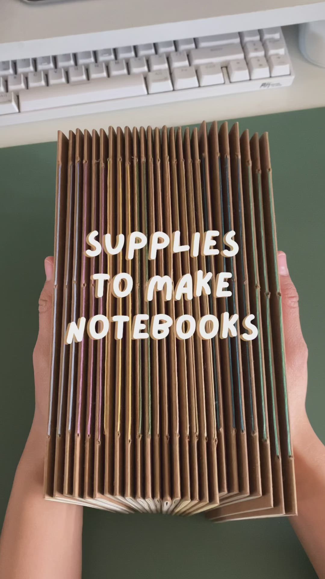 This may contain: someone is holding up a book with the words supplies to make notebooks written on it