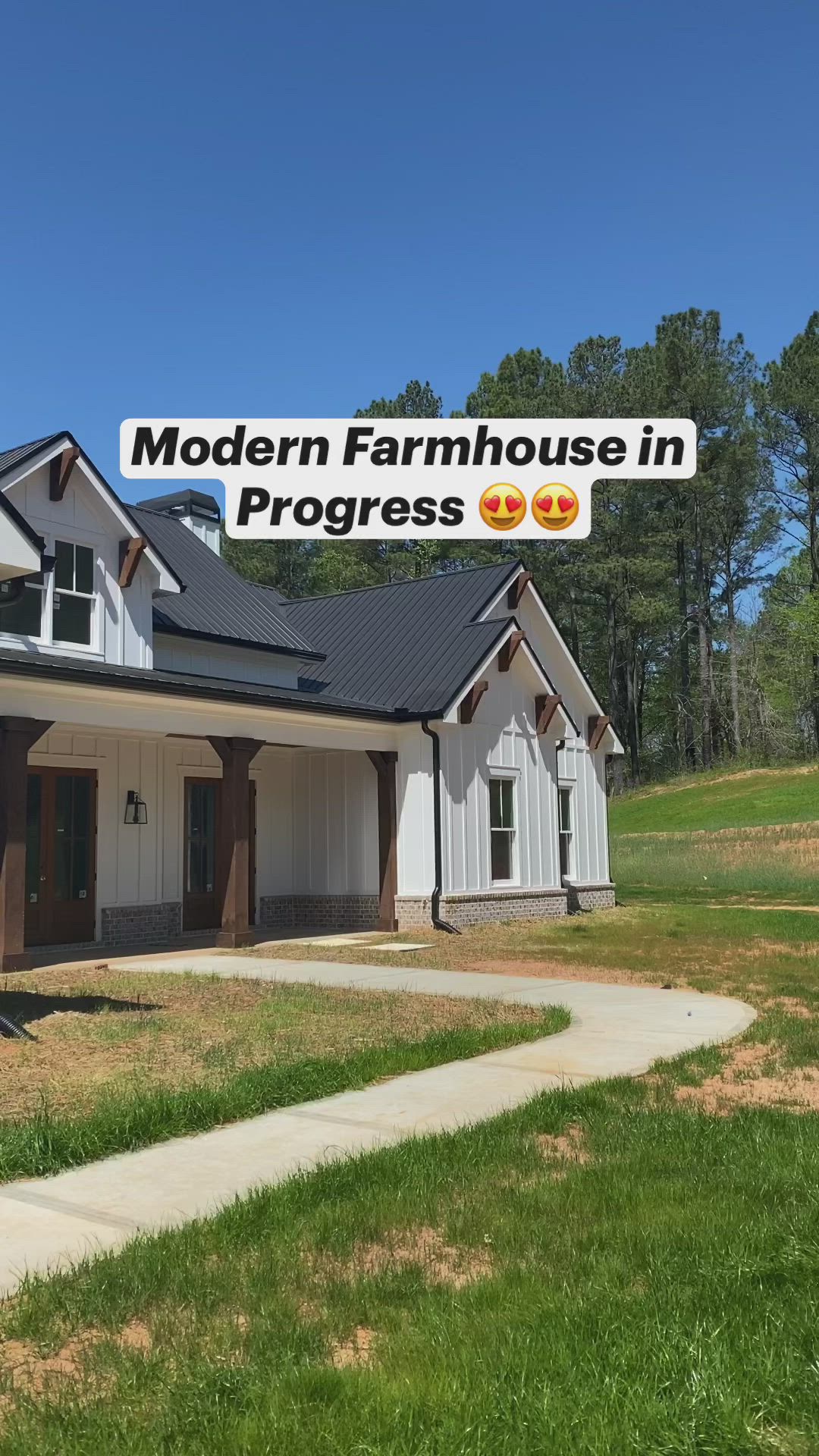 This may contain: the modern farmhouse house in progress is ready for its new owner to use it's front yard