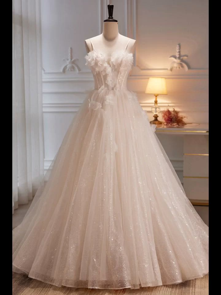 This contains: Beautiful Long Bling Tulle Ivory Ballgown Wedding Dress with Flowers