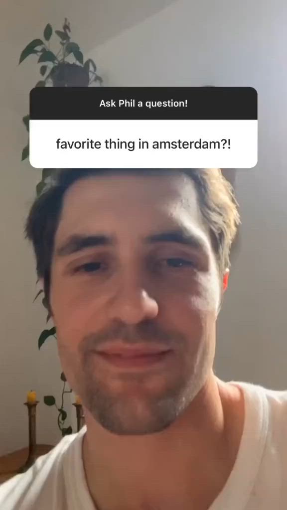This may contain: a man is looking at the camera and has an interesting question on his face that says favoite thing in amsterdam?