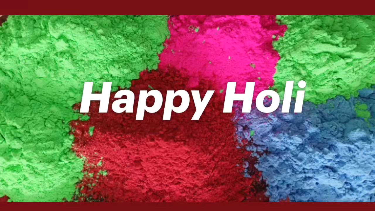 This may contain: the words happy holi written in white on top of colorful powdered paper with red, green and blue colors