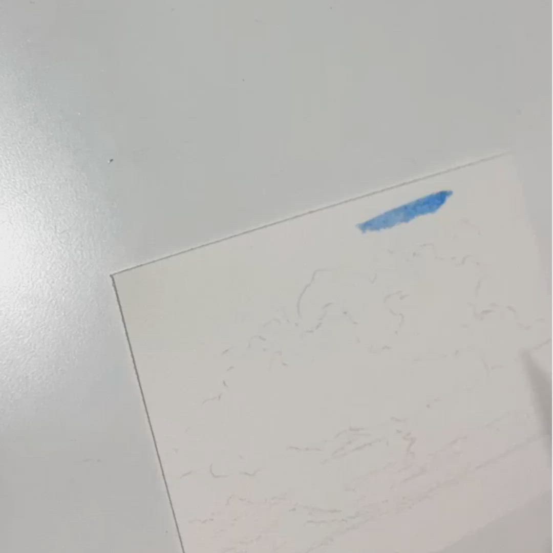 This may contain: someone is painting an image with watercolors on paper and using a paintbrush