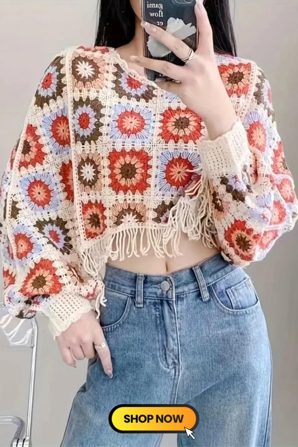 This may contain: the woman is taking a selfie with her cell phone while wearing a crochet top