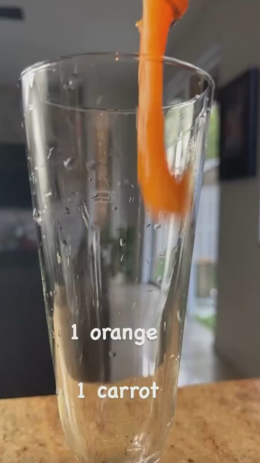 This may contain: an orange juice is being poured into a cup with instructions on how to use it