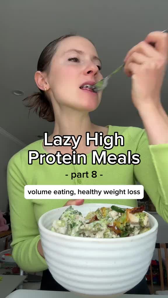 This may contain: the woman is eating her meal with a spoon in her mouth and text that reads, lazy high protein meals part 8