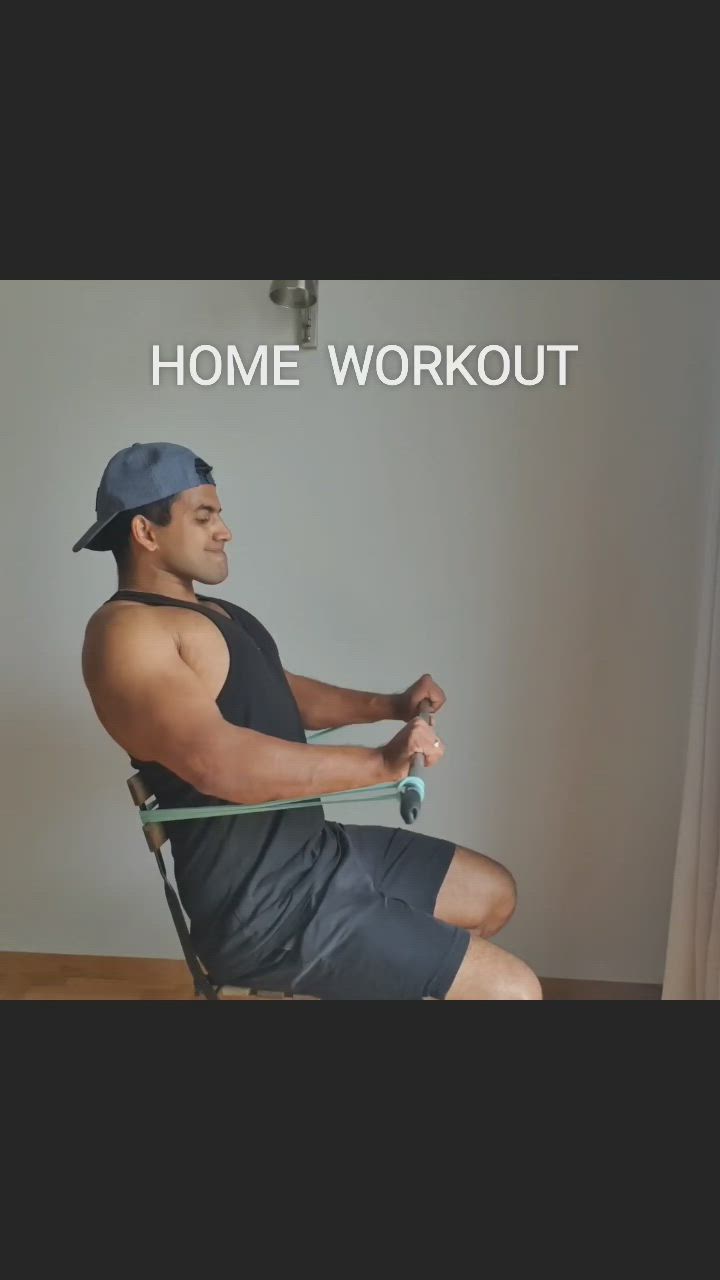 This may contain: a man sitting in a chair with the words home workout on it