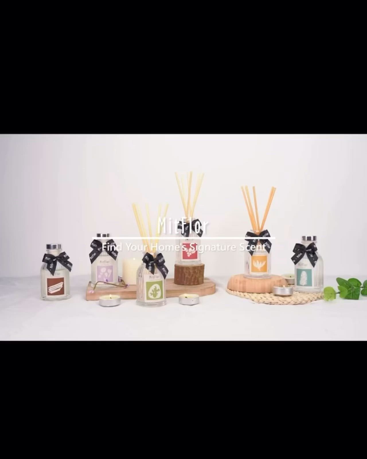 This may contain: an image of a candle and reed diffuser on a white table with a box