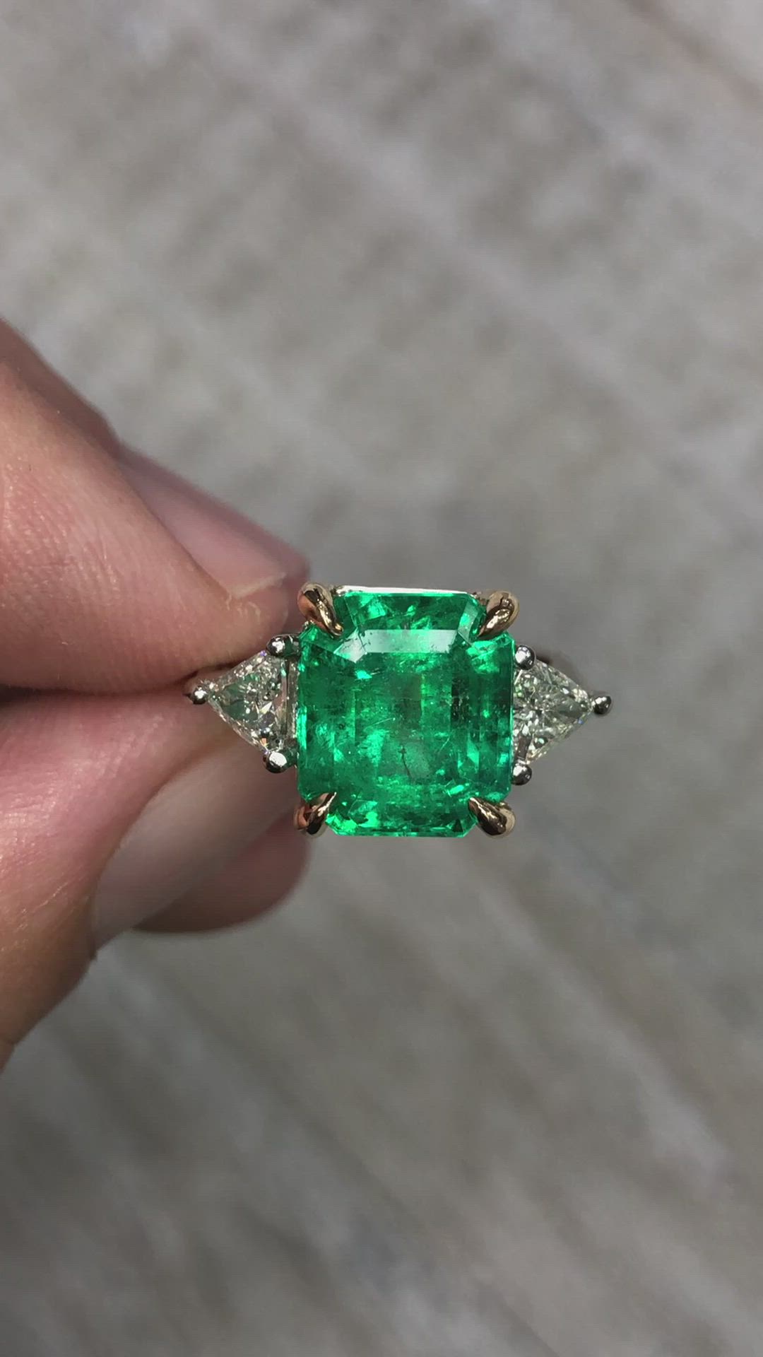 This contains an image of: Three stone 5 carat emerald cut Colombian emerald and trillion diamond ring 18K Two Tone