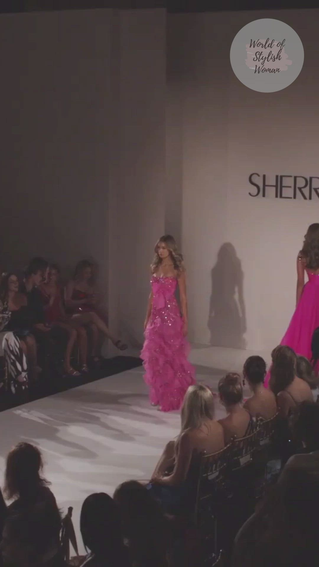 This contains: Strapless Mermaid Pink Prom Dress. Spring 2023 Collection. Runway Show by Sherri Hill.