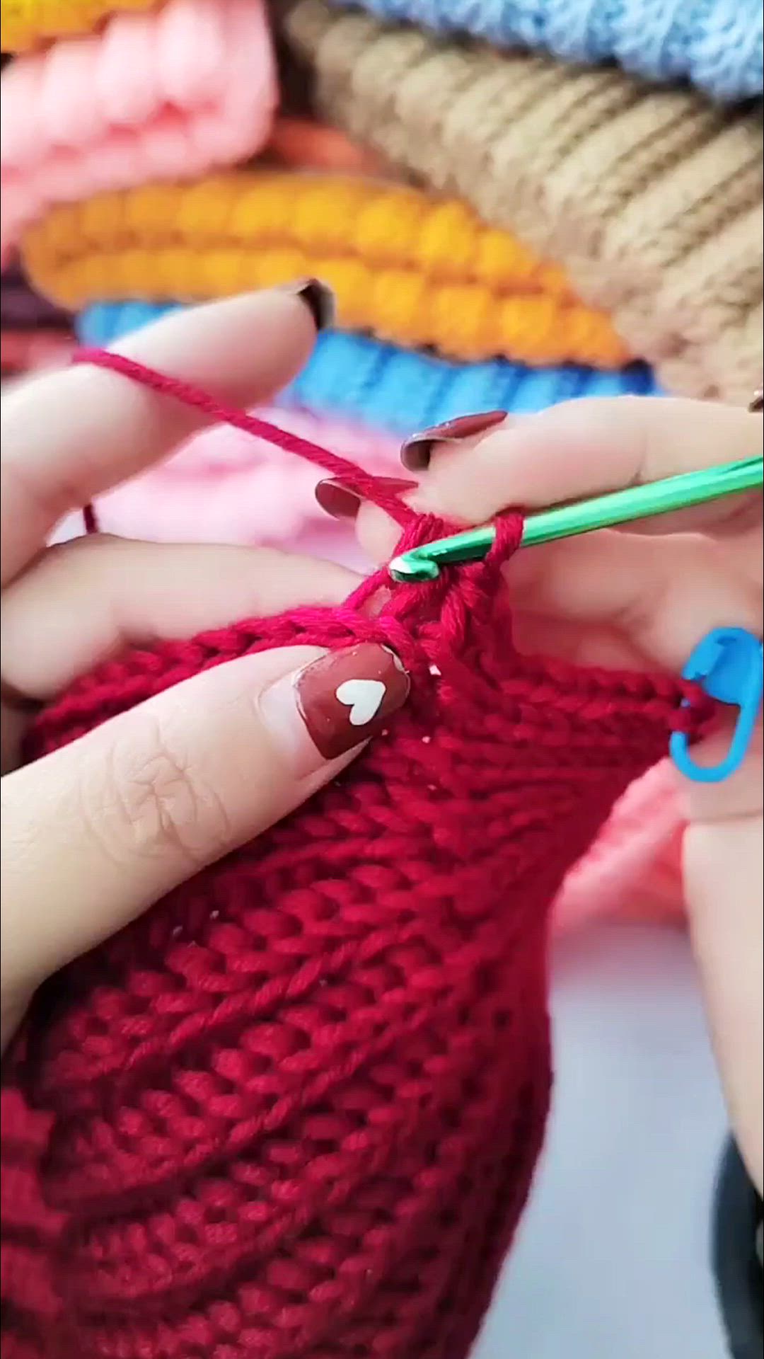 This may contain: a woman is knitting with scissors in her hand