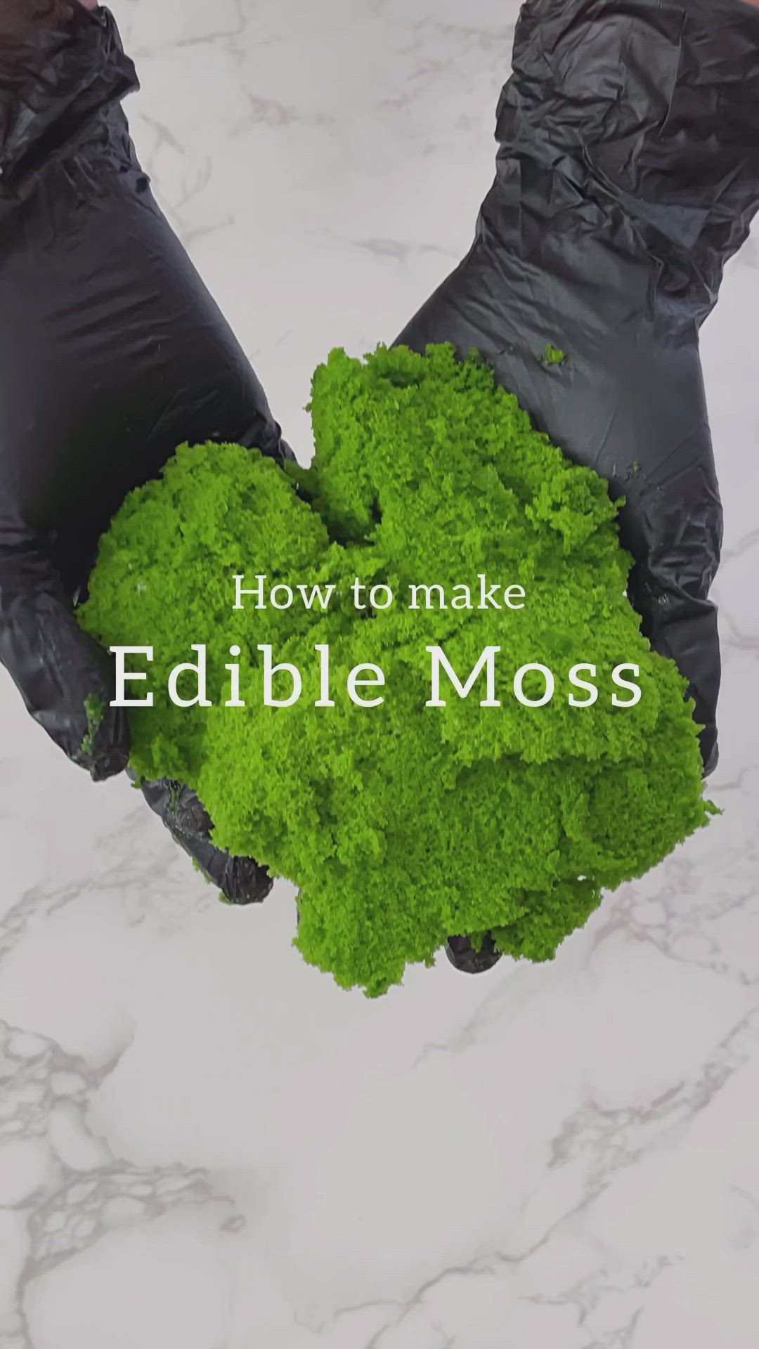 This may contain: hands in black gloves holding green vegetables with the words how to make edible moss