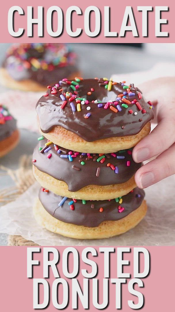 This may contain: chocolate frosted donuts stacked on top of each other