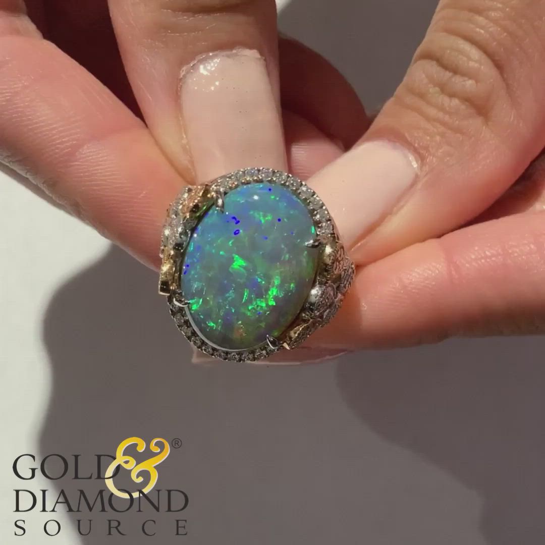 Have you ever seen a Black Opal? 🖤Take a look at this Gorgeous Juleve 18 Karat Two-Tone Gold Half Halo Milgrain Ring Featuring a 9.33 Carat Oval Cabochon Black Opal & .78 Carat Total Weight Round Brilliant Diamonds. #GDSStyle #GoldandDiamondSource #GoldandDiamond #jewelrytrends #Diamonds #HighJewelry #DiamondRings #EngagementVibes #Opal #jewelry #love #fashion #style #gemstones #finejewelry #jotd #opalring #OctoberBirthstone #October #HolidayGift