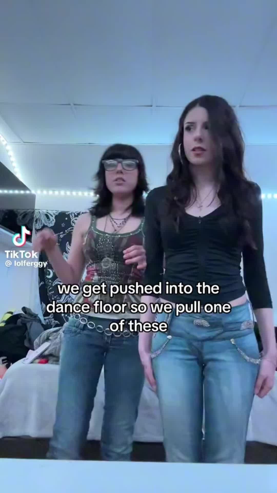 This may contain: two women standing next to each other in front of a mirror with the caption, we get pushed into the dance floor so we pull one off these