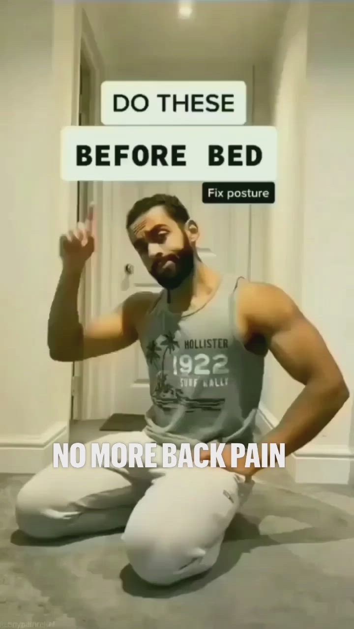 This may contain: a man is sitting on the floor with his hands up in front of him while holding a sign that says do these before bed no more back pain