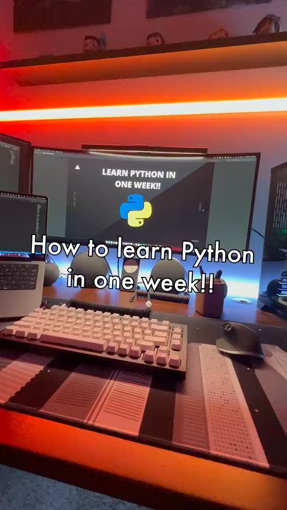 This may contain: there is a computer and keyboard on the desk with words above it that read how to learn - python in one week