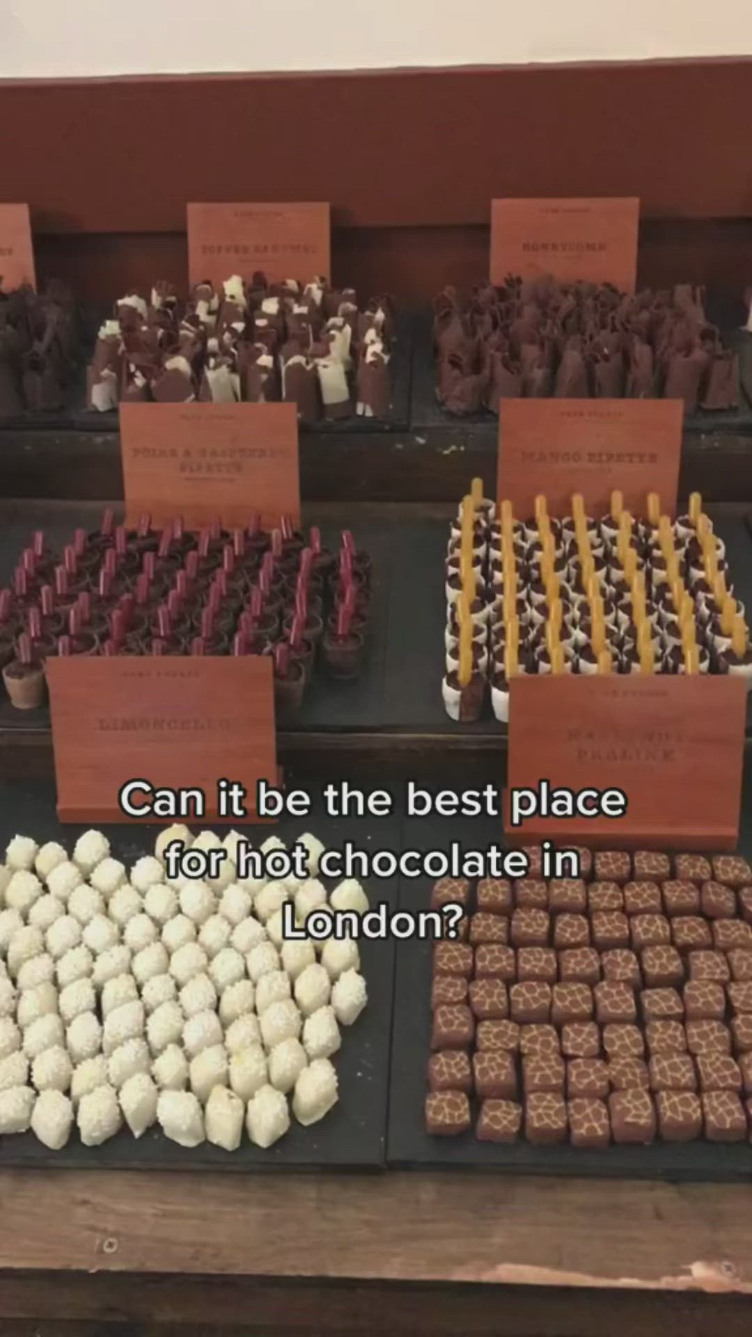 This may contain: there are many different types of chocolates on display