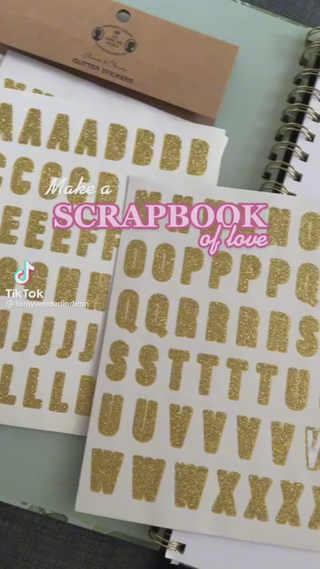 This may contain: three notebooks with gold foil on them and the words scrapbook written in large letters